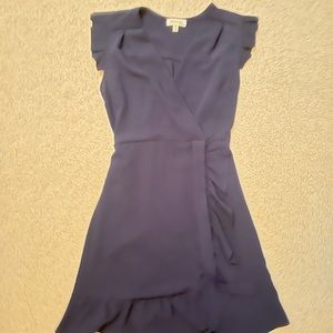 Blue wrap-dress with bow and ruffle sleeves